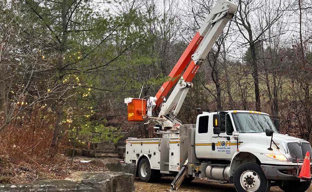 XOH truck in the woods to do some tree trimming.