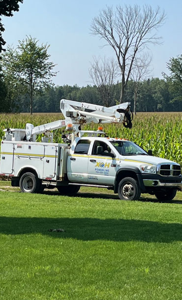 XOH Powerline service truck in a field.